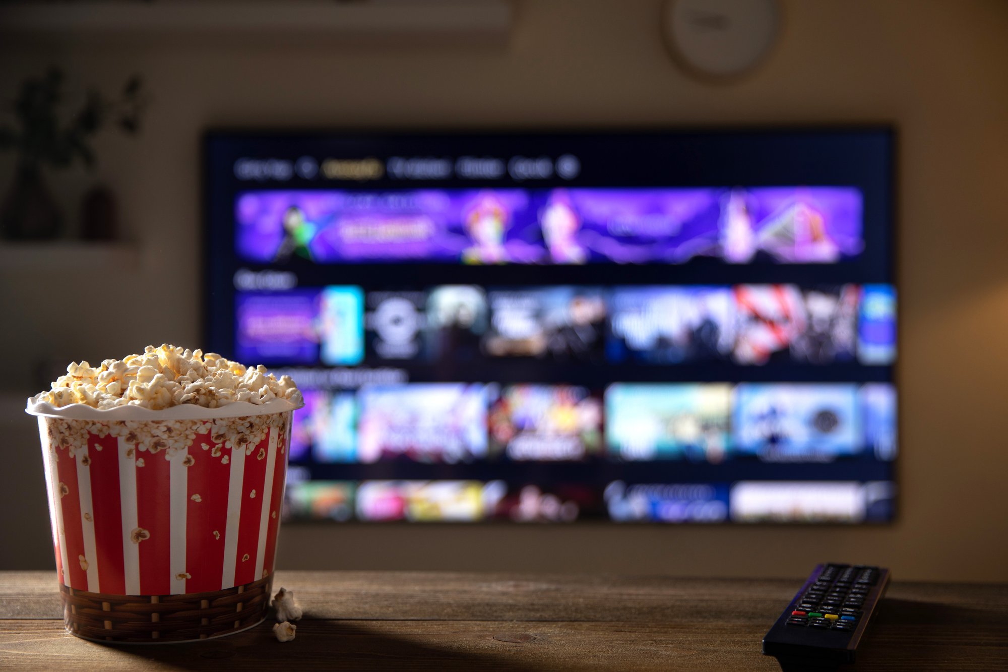 close-up-of-bowl-of-popcorn-and-remote-control-wit-2024-12-06-22-09-48-utc